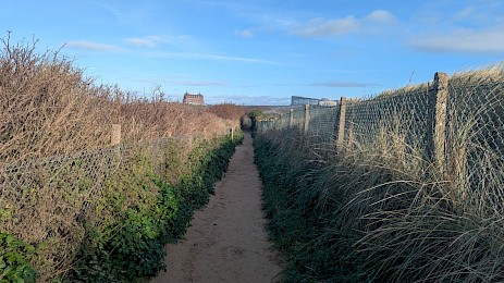 Walking the South West Coastal Path, looking towards Headland Road.